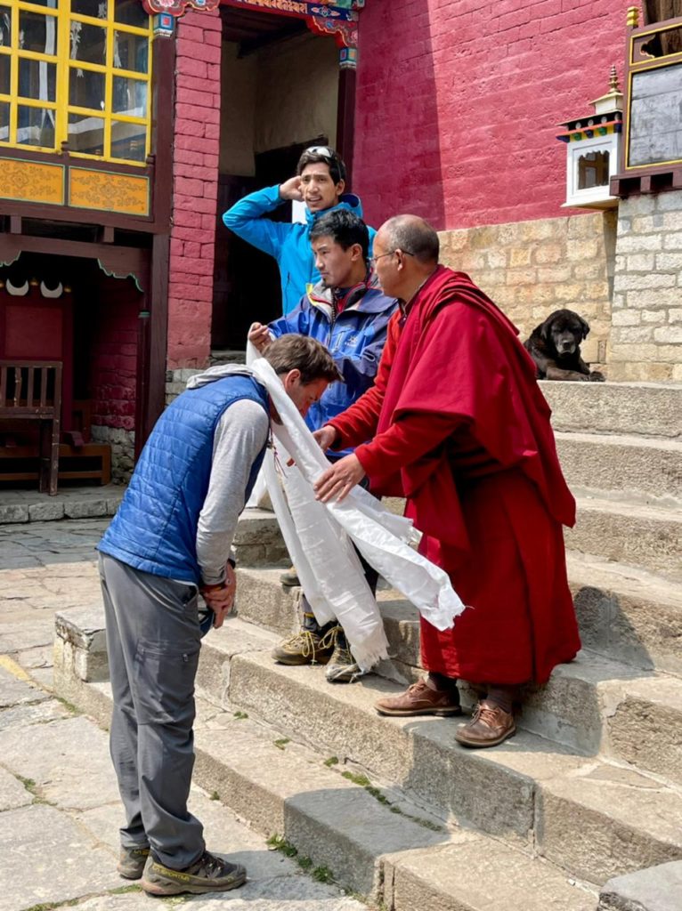 Receiving a traditional blessing at Tengboche Monastery - Photo Tommas Ceppi