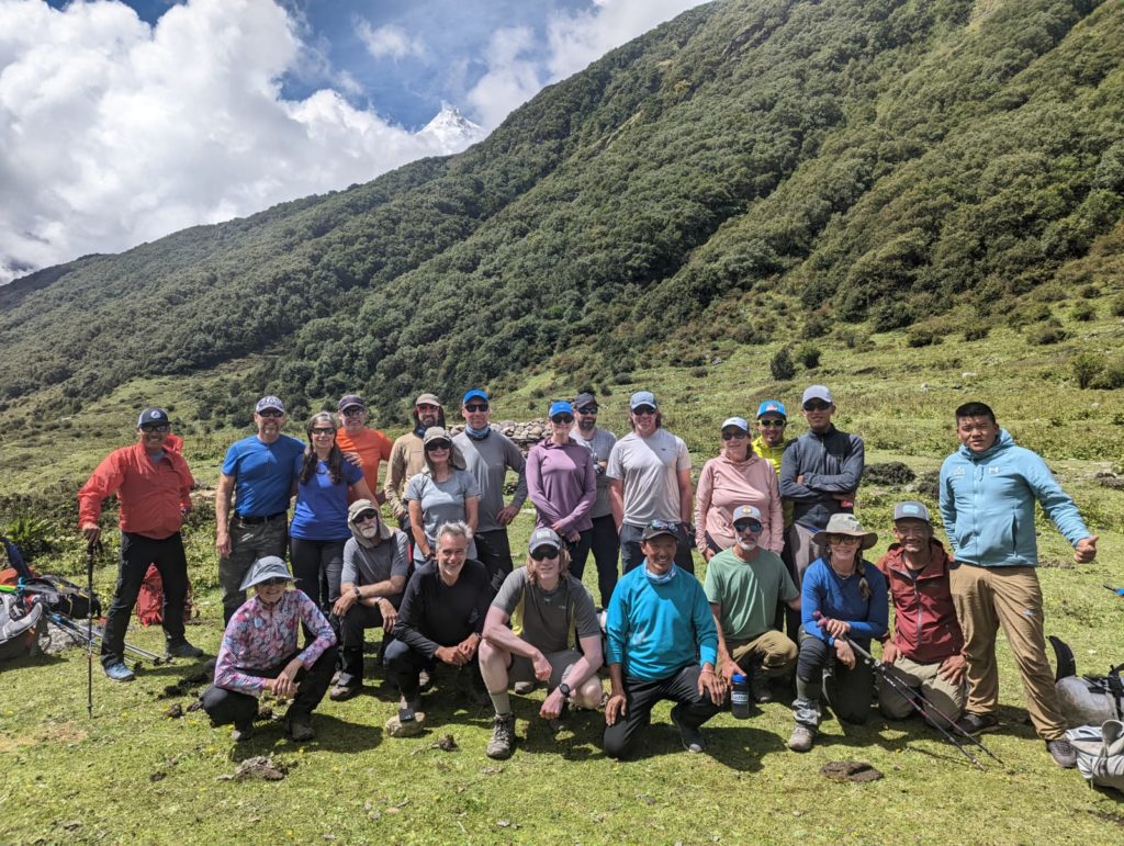 CTSS Manaslu Climbing and Trekking teams on the way to Samaguan, Manaslu peeking through the clouds - Photo Robert Jantzen