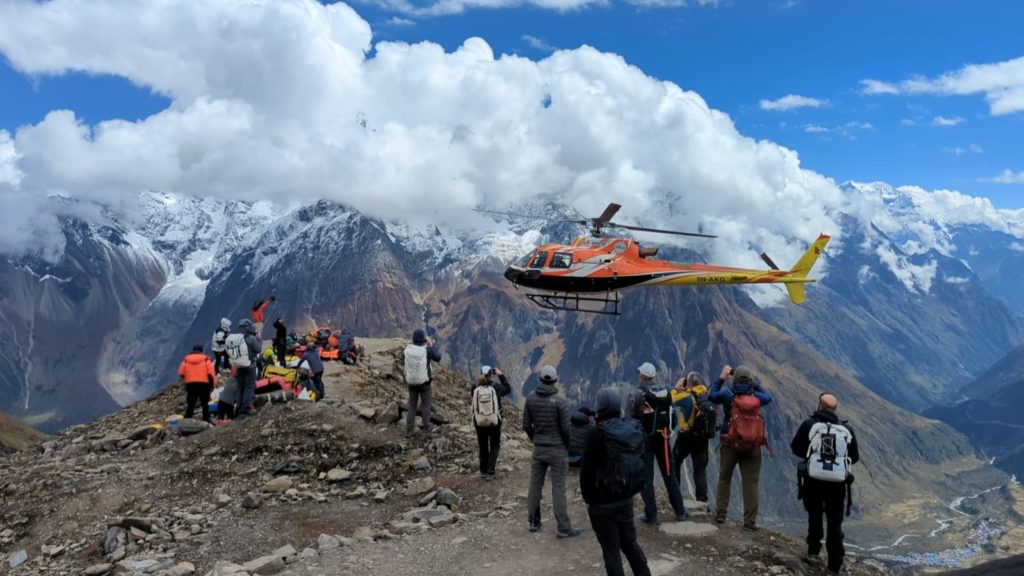 Helicopter arriving to transport the CTSS team back to Kathmandu - Photo Robert Jantzen